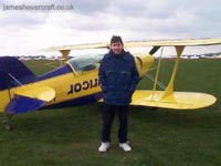 Me next to an aerobatic Pitts airplane, on a trial aerobatics lesson run by Alan Cassidy (competition winning aerobatics pilothttp://www.worldaerobatics.com/)