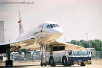 Concorde G-BOAG being taxiied behind the BA engineering workshops at London Heathrow Airport