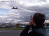 Me taking video of a MD-87 SAS airplane coming into land at Heathrow Airport, 2001