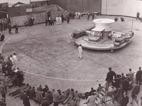 The first flight of the SRN1 on the concrete slipway at East Cowes. The astonished crowd of photographers and journalists would have seen nearly a foot of air beneath the craft during its hover. Note the ground wheels attached to the four corners of the craft
