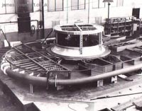 The shell of the SRN1 during construction. The engine mount and main intake is clearly visible as is the inner shell of the plenum chamber. The top criss-cross of beams is the start of the outer layer of the plenum which, when reaching the edges of the craft, deflected the air downwards creating the famous air cushion effect by Momentum Curtain