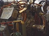 The Rolls Royce Proteus marine gas turbine engine used on the SRN4s. Mk I and II craft used a less powerful version of the Mk III craft but the basic engine is the same. Engine details can be found in the SRN4 section. <br><br>This photograph shows the various fuel pipes (red) and their servo control valves leading to the eight combustion chambers on this gas turbine, as well as the output spindle onto which could be attached the main drive shafts of the craft. Nominal speed of the engine output shaft during cruise was 11,500rpm, with 10,750rpm on the turbine and 11,100rpm on the compressor.