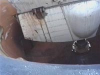 A view down the air intake of the forward port engine, showing a lift fan in position at the bottom of the shaft. Note also the hinged door in the centre of the shot. This would slam shut in the event of engine failure by means of the air pressure behind it, preventing the escape of air through the intakes and thus allowing the air input to the skirt from the remaining engines to keep the skirt inflated. The SRN4 is capable of hovering and moving on just one engine, although not very fast or efficiently.